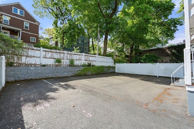 117 Sycamore St Unit 1, Boston, MA 02131 - uncovered parking lot with fence