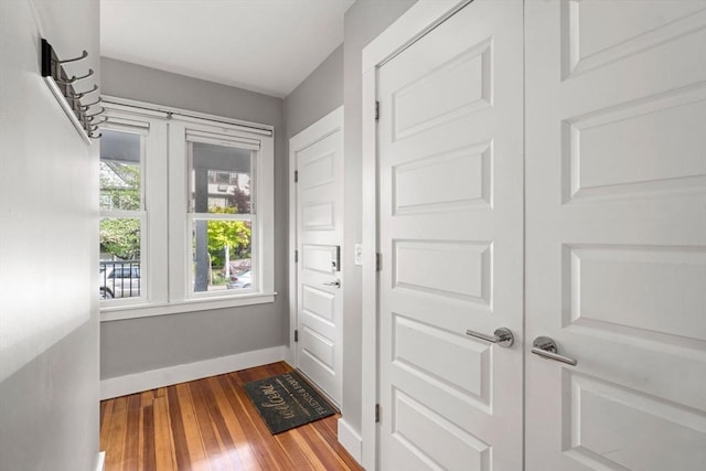 117 Sycamore St Unit 1, Boston, MA 02131 - entryway with baseboards and wood-type flooring