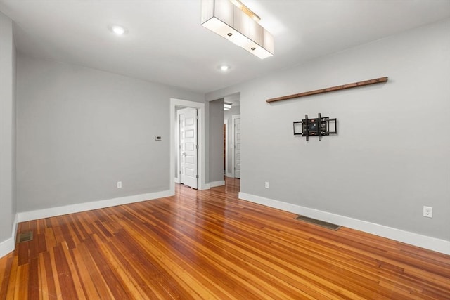 117 Sycamore St Unit 1, Boston, MA 02131 - unfurnished room with baseboards, wood finished floors, and recessed lighting