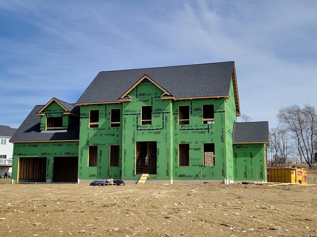 property in mid-construction with roof with shingles