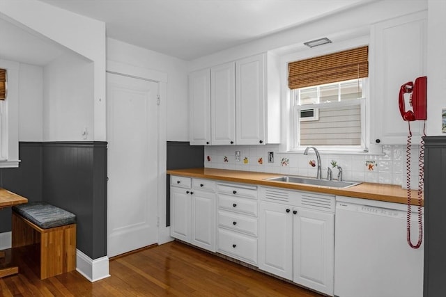 24 Neponset Rd, Quincy, MA 02169 - kitchen featuring white dishwasher, a sink, dark wood-style floors, white cabinets, and a wainscoted wall