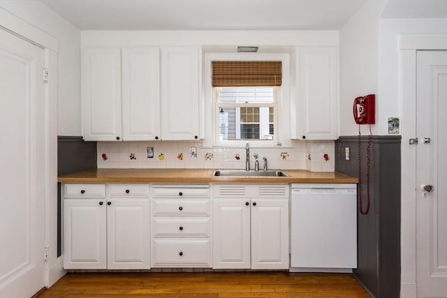 24 Neponset Rd, Quincy, MA 02169 - kitchen with white dishwasher, a sink, and white cabinets