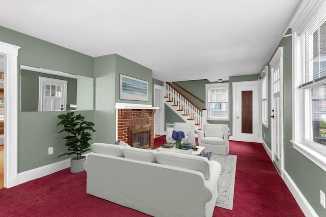 24 Neponset Rd, Quincy, MA 02169 - living room with a brick fireplace, carpet, baseboards, and stairs