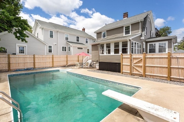 24 Neponset Rd, Quincy, MA 02169 - view of pool featuring a patio, a fenced backyard, and a diving board