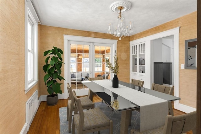 24 Neponset Rd, Quincy, MA 02169 - dining room with baseboards, a chandelier, radiator, healthy amount of natural light, and wallpapered walls