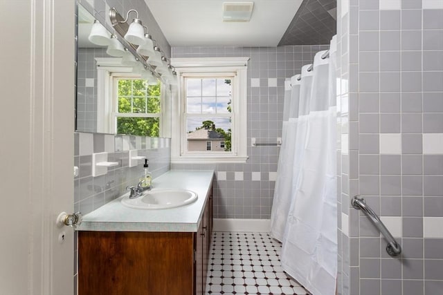 24 Neponset Rd, Quincy, MA 02169 - full bath featuring tile walls, vanity, tile patterned floors, and a shower with curtain