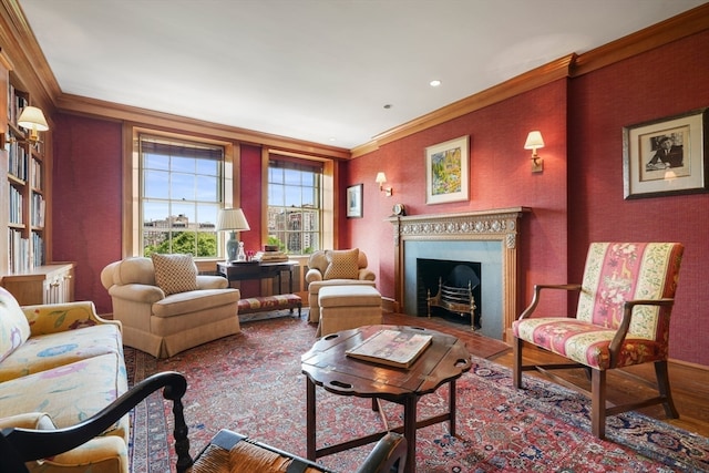 living area featuring hardwood / wood-style flooring and ornamental molding