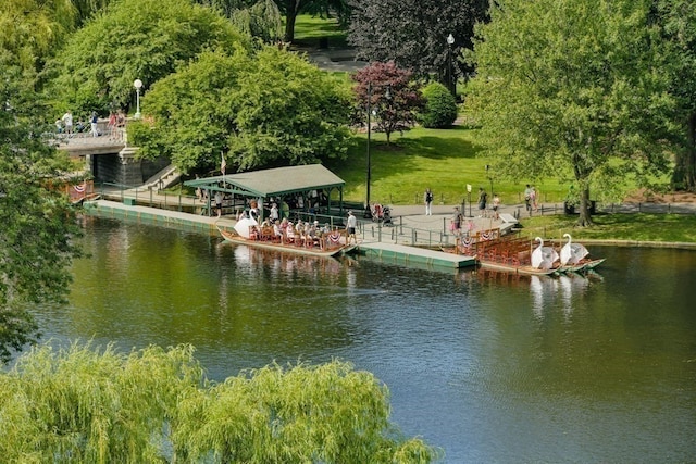 exterior space with a lawn and a water view