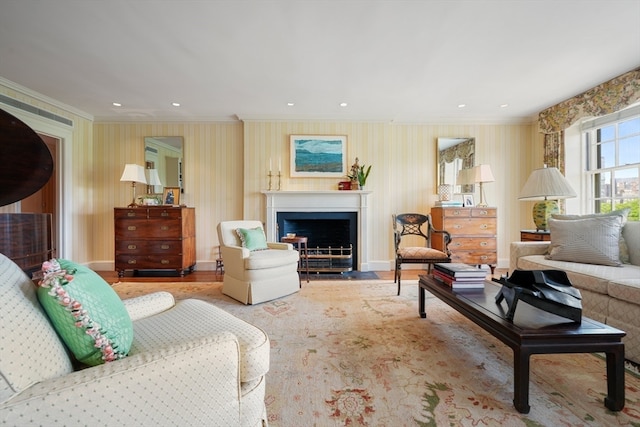 living room featuring light hardwood / wood-style flooring and ornamental molding