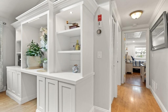 25 12th Ave, Halifax, MA 02338 - hall featuring light wood-style floors, ornamental molding, and attic access