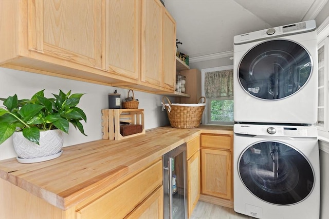 25 12th Ave, Halifax, MA 02338 - laundry room featuring stacked washer / drying machine, beverage cooler, cabinet space, and crown molding