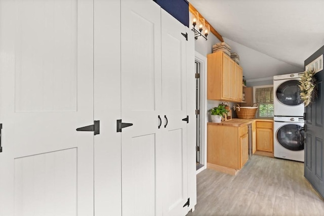 25 12th Ave, Halifax, MA 02338 - laundry room featuring stacked washer / drying machine, cabinet space, light wood-style flooring, and ornamental molding