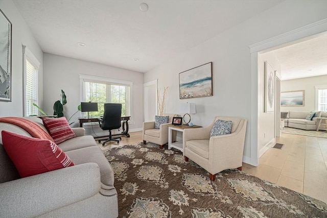 living room with baseboards, recessed lighting, wood finished floors, and visible vents