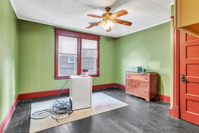 office with ceiling fan, dark hardwood / wood-style floors, and ornamental molding