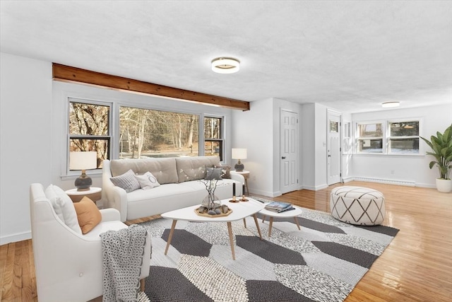 260 Great Rd, Stow, MA 01775 - living area with a textured ceiling, baseboards, and wood finished floors