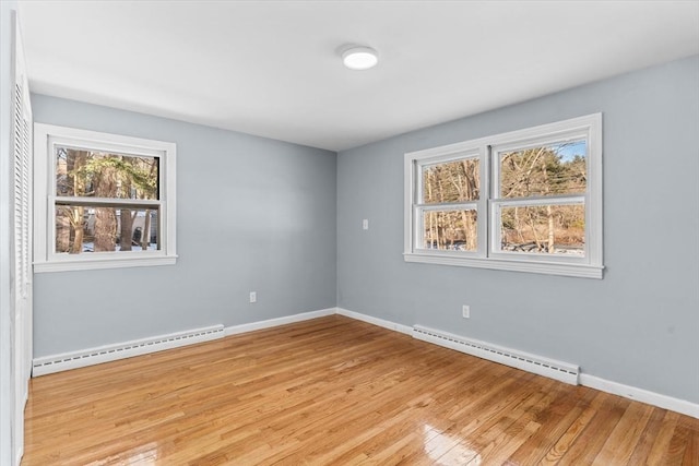 260 Great Rd, Stow, MA 01775 - spare room featuring baseboards, light wood-style floors, and baseboard heating