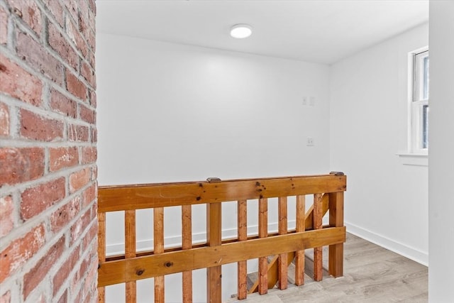 260 Great Rd, Stow, MA 01775 - bedroom featuring wood finished floors, brick wall, and baseboards