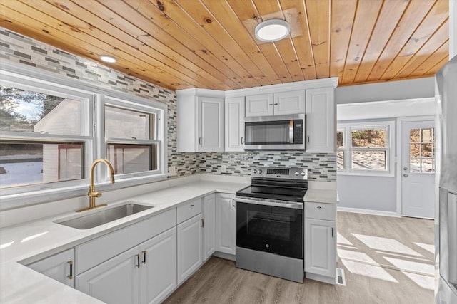 260 Great Rd, Stow, MA 01775 - kitchen with stainless steel appliances, tasteful backsplash, light countertops, and a sink