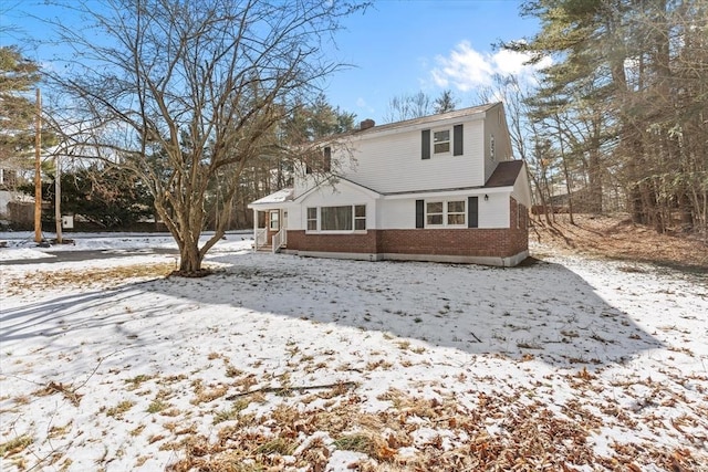 260 Great Rd, Stow, MA 01775 - snow covered back of property featuring brick siding
