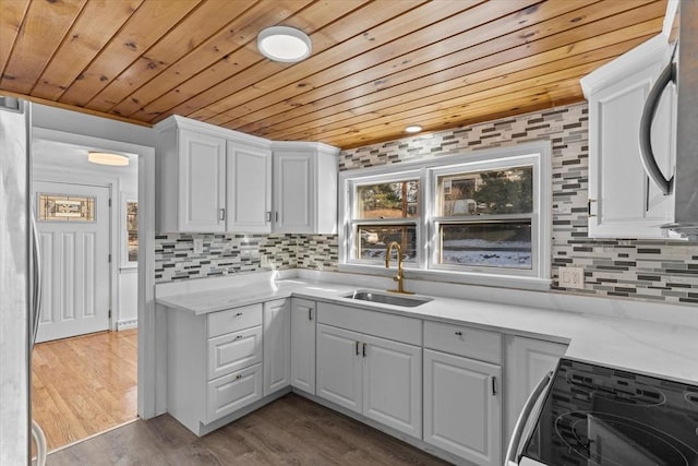 260 Great Rd, Stow, MA 01775 - kitchen featuring range with electric cooktop, wooden ceiling, a sink, and backsplash