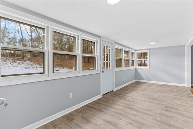 260 Great Rd, Stow, MA 01775 - unfurnished room featuring a wealth of natural light, baseboards, and wood finished floors