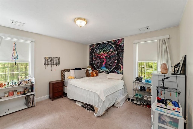 carpeted bedroom featuring baseboards