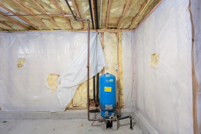 unfinished basement with a water pressure tank