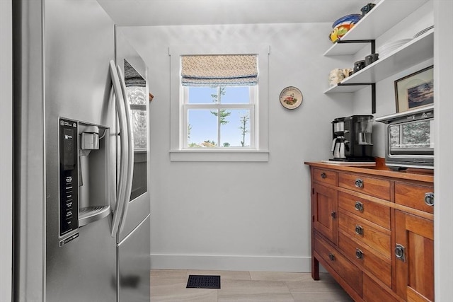 124 Osgood Rd, Charlton, MA 01507 - kitchen with stainless steel fridge, baseboards, brown cabinetry, and open shelves