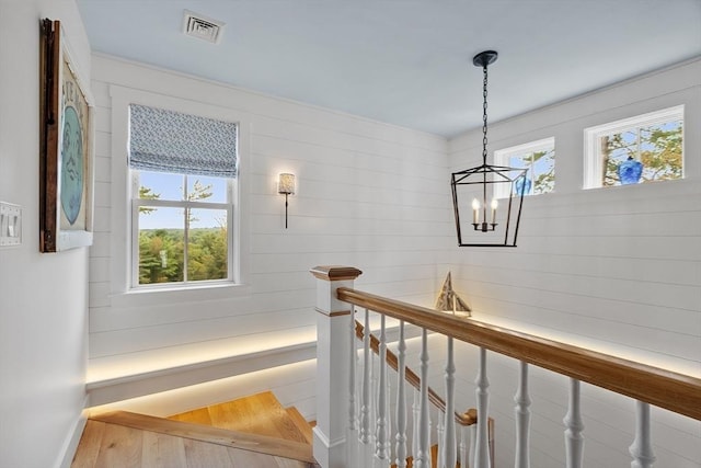 124 Osgood Rd, Charlton, MA 01507 - stairs with a chandelier, wood finished floors, and baseboards