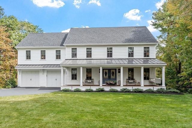 124 Osgood Rd, Charlton, MA 01507 - view of front facade with a standing seam roof, covered porch, and a front yard