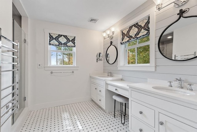 124 Osgood Rd, Charlton, MA 01507 - full bathroom with tile patterned floors, healthy amount of natural light, vanity, and baseboards