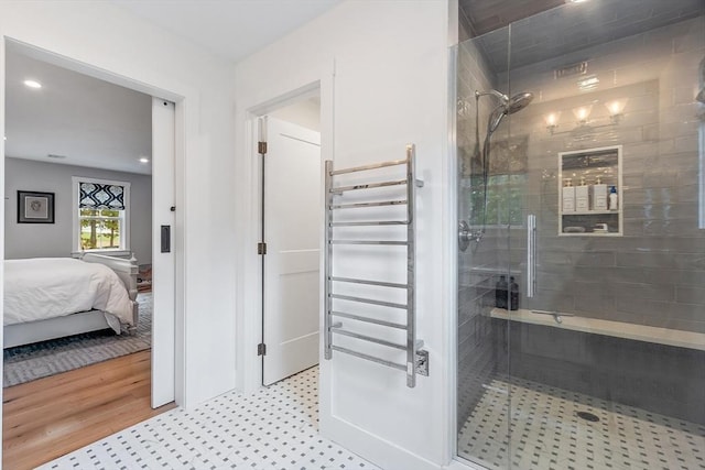 124 Osgood Rd, Charlton, MA 01507 - bathroom with a towel warmer, a stall shower, radiator, connected bathroom, and recessed lighting