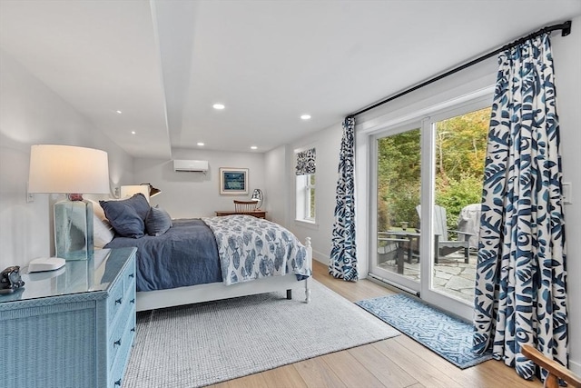 124 Osgood Rd, Charlton, MA 01507 - bedroom with a wall unit AC, access to exterior, wood finished floors, and recessed lighting