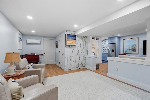 124 Osgood Rd, Charlton, MA 01507 - living area featuring an AC wall unit, light wood-style floors, baseboards, and recessed lighting
