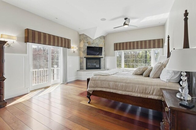 58 Bridle Path, Tewksbury, MA 01876 - bedroom featuring wood-type flooring, a decorative wall, and a wainscoted wall