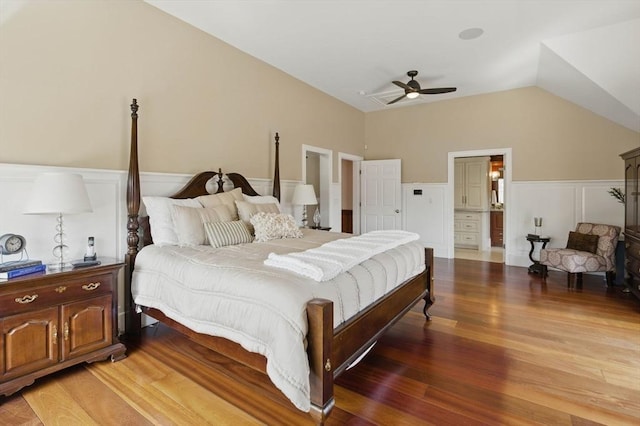 58 Bridle Path, Tewksbury, MA 01876 - bedroom featuring wainscoting, a decorative wall, a ceiling fan, light wood-style flooring, and vaulted ceiling