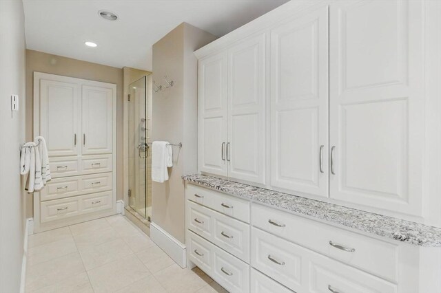 58 Bridle Path, Tewksbury, MA 01876 - bathroom with baseboards, tile patterned flooring, a stall shower, and recessed lighting