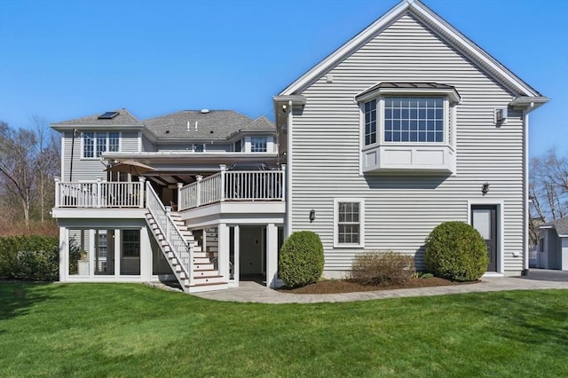 58 Bridle Path, Tewksbury, MA 01876 - rear view of property with a yard, a deck, and stairs