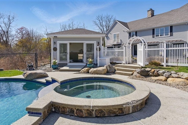 58 Bridle Path, Tewksbury, MA 01876 - view of pool with a fenced in pool, an in ground hot tub, fence, and an outbuilding