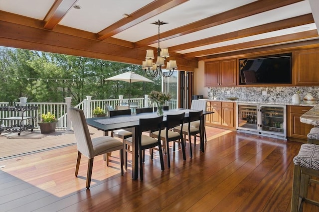 58 Bridle Path, Tewksbury, MA 01876 - dining area with beverage cooler, a chandelier, dark wood-style floors, and beamed ceiling