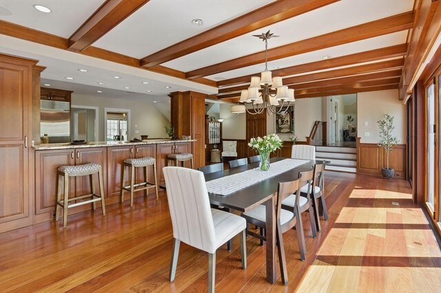 58 Bridle Path, Tewksbury, MA 01876 - dining room featuring a notable chandelier, recessed lighting, wood finished floors, beamed ceiling, and stairway