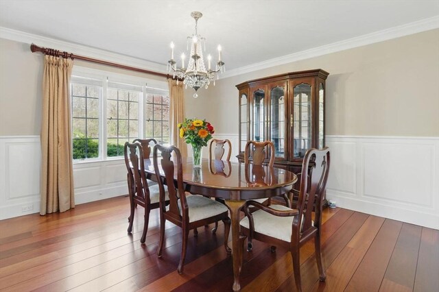 58 Bridle Path, Tewksbury, MA 01876 - dining space featuring crown molding, wainscoting, hardwood / wood-style flooring, a chandelier, and a decorative wall