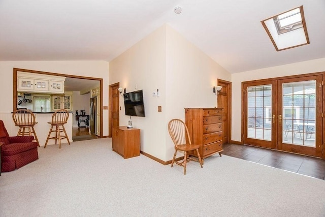 670 Front St, Marion, MA 02738 - sitting room with vaulted ceiling, french doors, carpet flooring, and a skylight