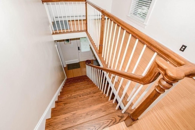 670 Front St, Marion, MA 02738 - stairs featuring wood finished floors and baseboards