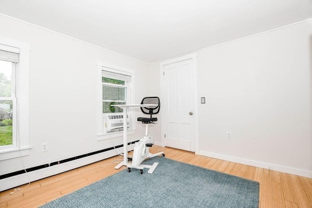 670 Front St, Marion, MA 02738 - workout area featuring baseboard heating and wood finished floors