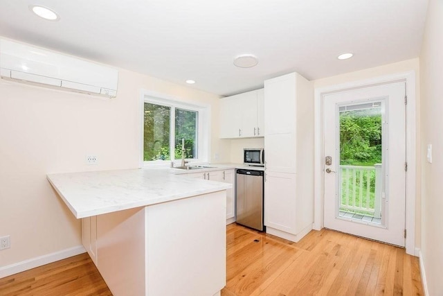 670 Front St, Marion, MA 02738 - kitchen featuring a peninsula, plenty of natural light, white cabinets, and recessed lighting