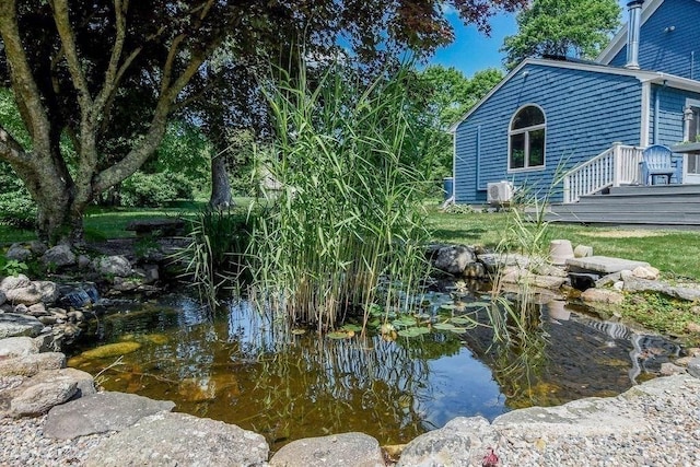 670 Front St, Marion, MA 02738 - view of yard featuring a garden pond and a wooden deck