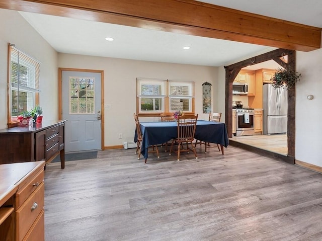 office area with recessed lighting, baseboards, baseboard heating, and light wood finished floors