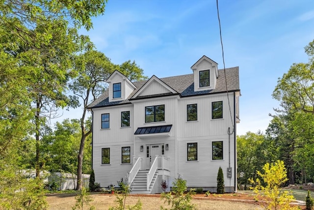 108 S St, Reading, MA 01867 - view of front of house with a standing seam roof, roof with shingles, and a metal roof