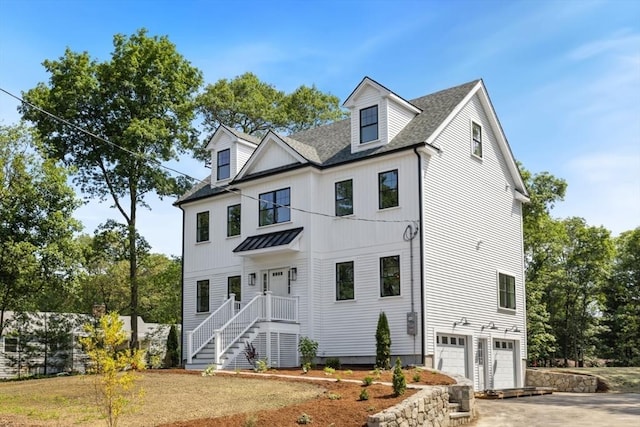 108 S St, Reading, MA 01867 - view of front of home featuring a garage, a shingled roof, a standing seam roof, driveway, and a metal roof